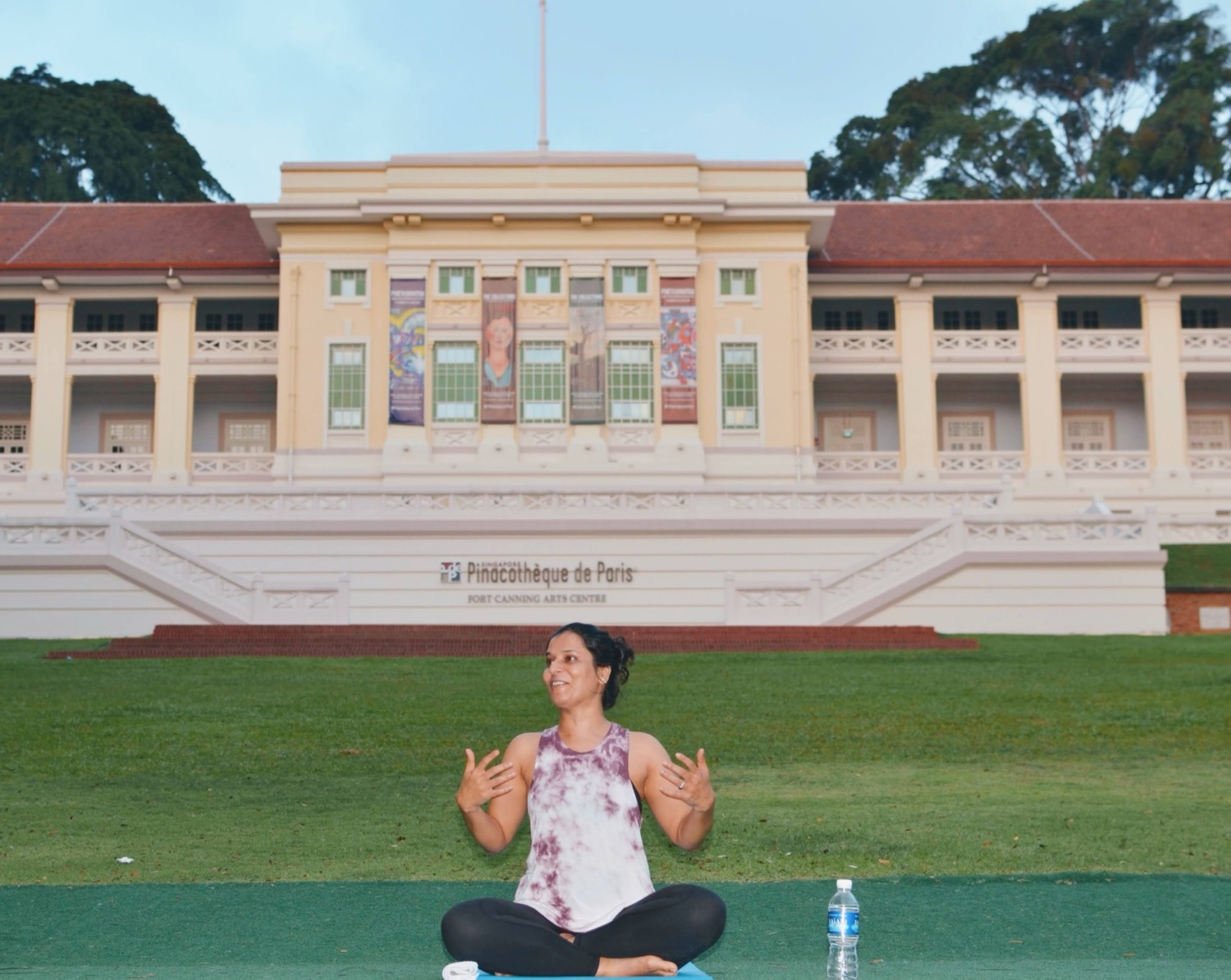 Sindhu teaching a class on the lawn at Fort Canning arts centre